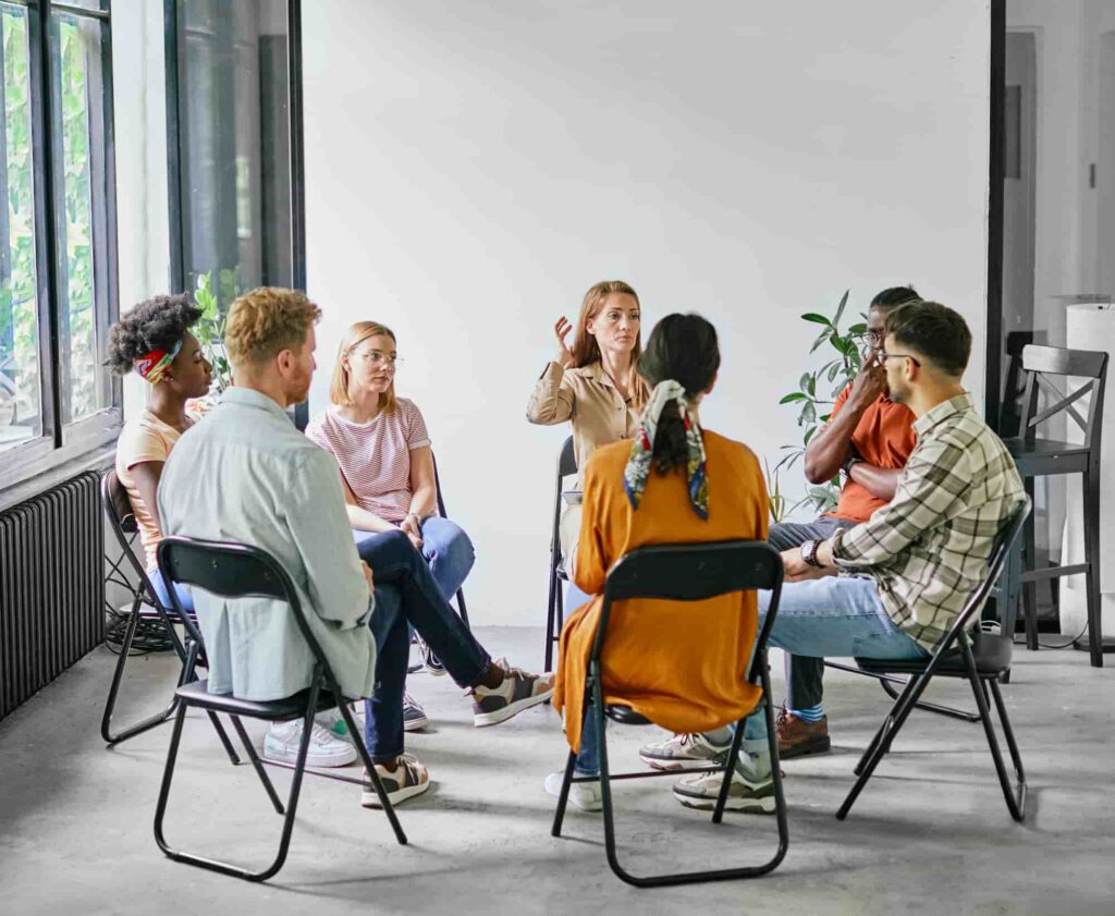Guide: Mental Health Diversion California (PC 1001.36) A small outpatient therapy group meeting in a bright room, the kind of program a court-approved treatment plan typically involves.