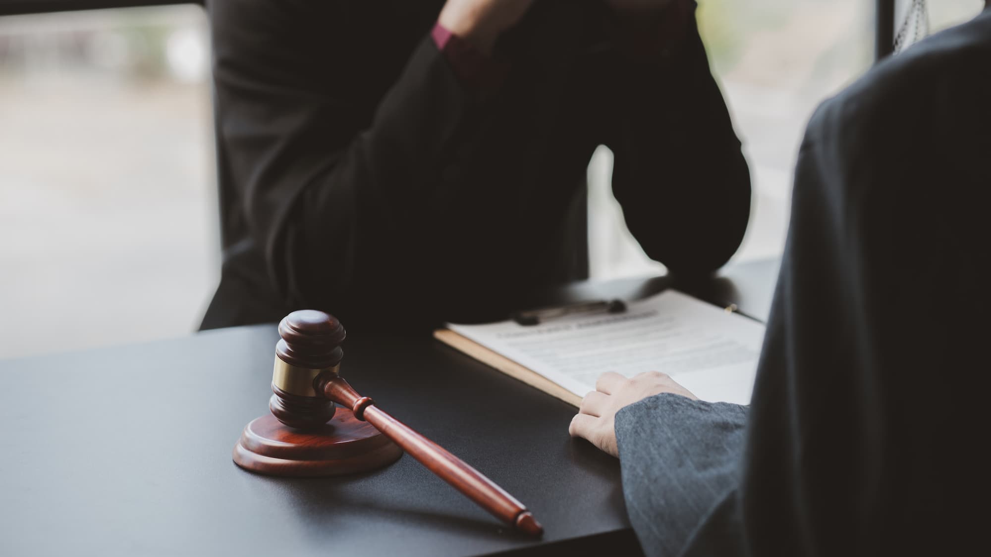 judicial decision gavel with legal document on desk